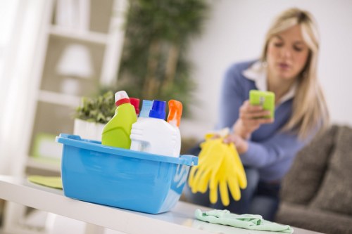 Technician using carpet cleaning equipment in Cambridge Heath